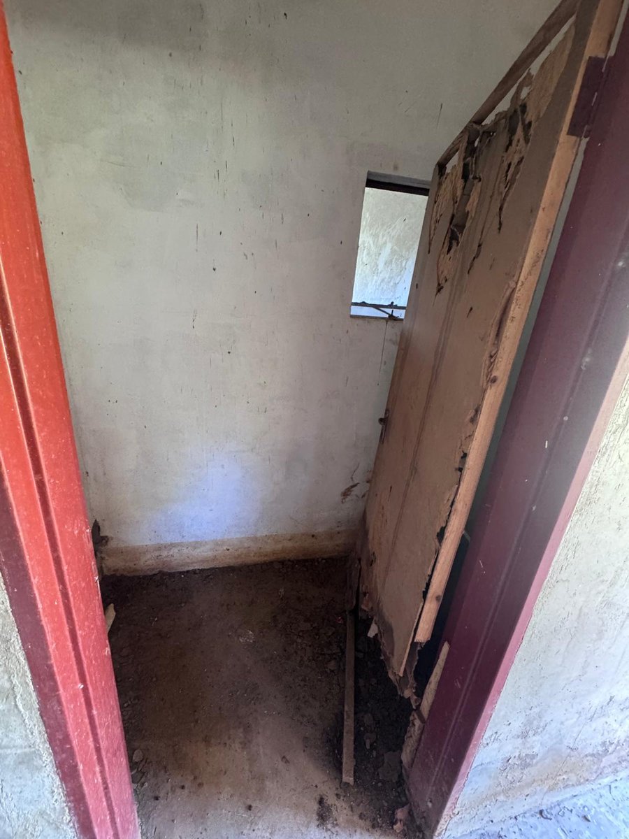 A damaged toilet door at the Community Centre