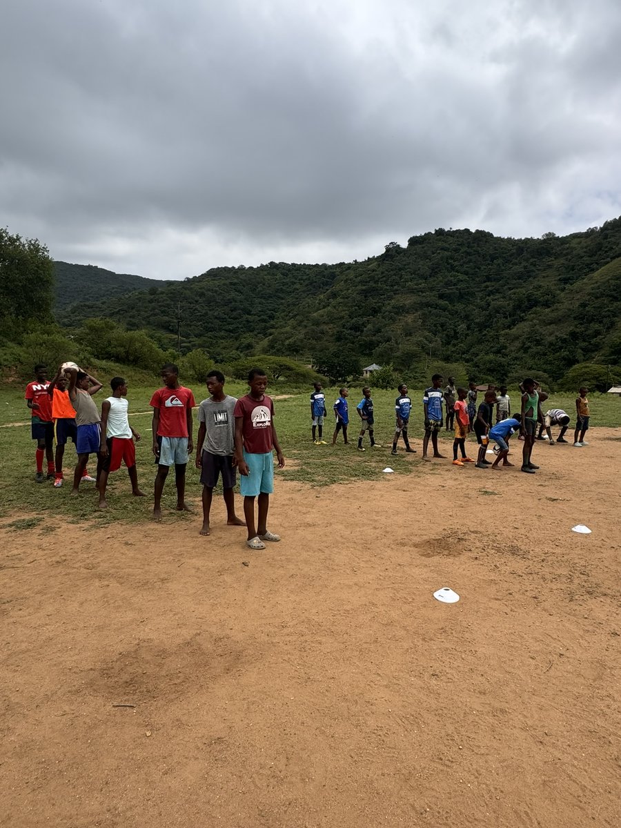 Children lined up during a community sports coaching session