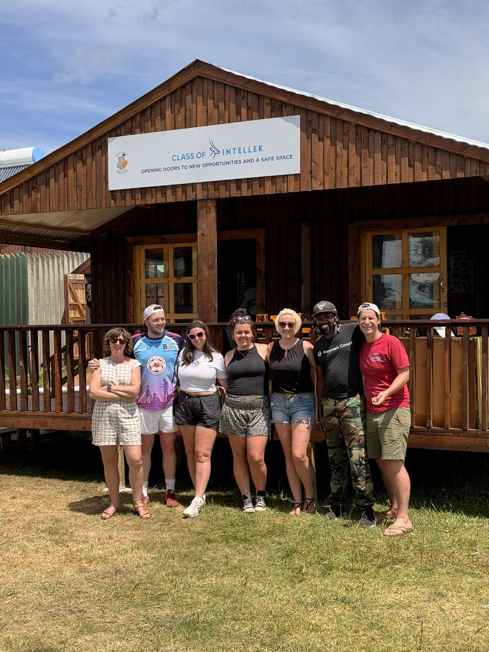 Claire and the Intellek team outside the new classroom they built in Inchanga