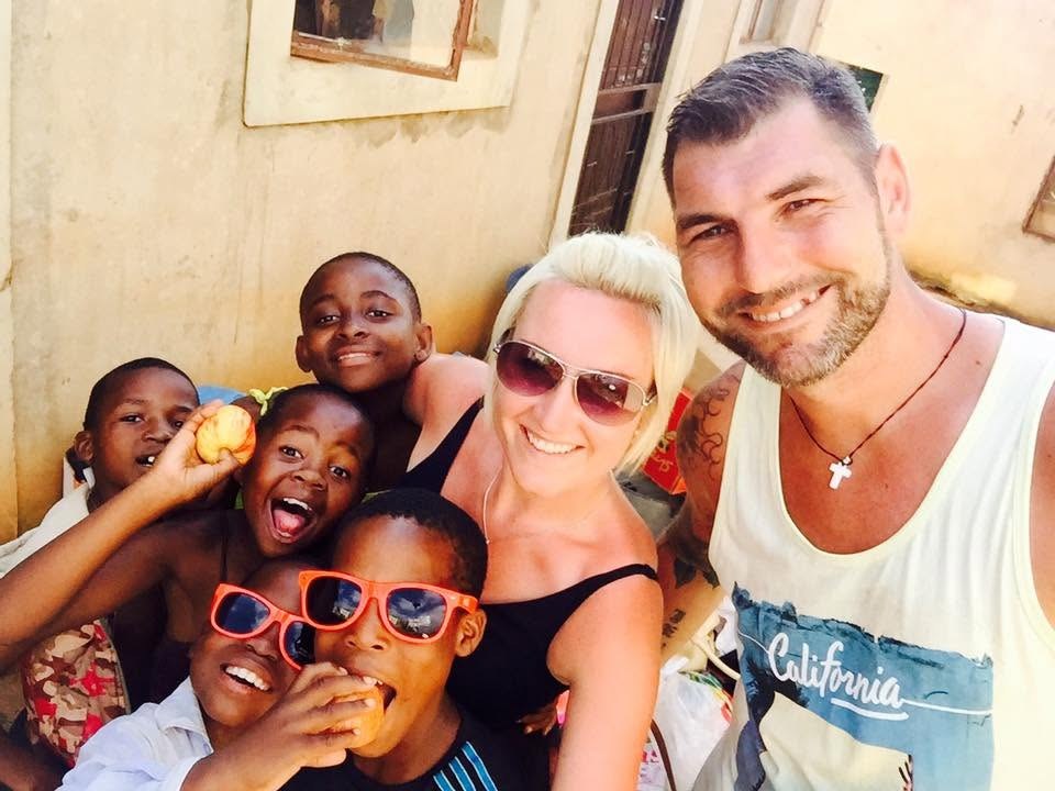 Claire and Jay with children in the Inchanga community in 2017