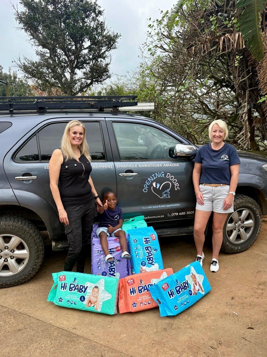 Opening Doors team delivering a donation of nappies