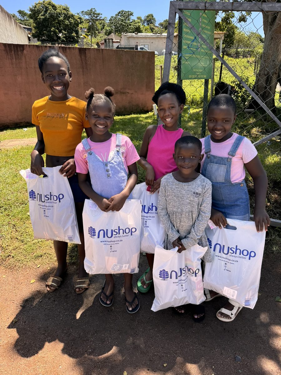 Children holding their new school supplies