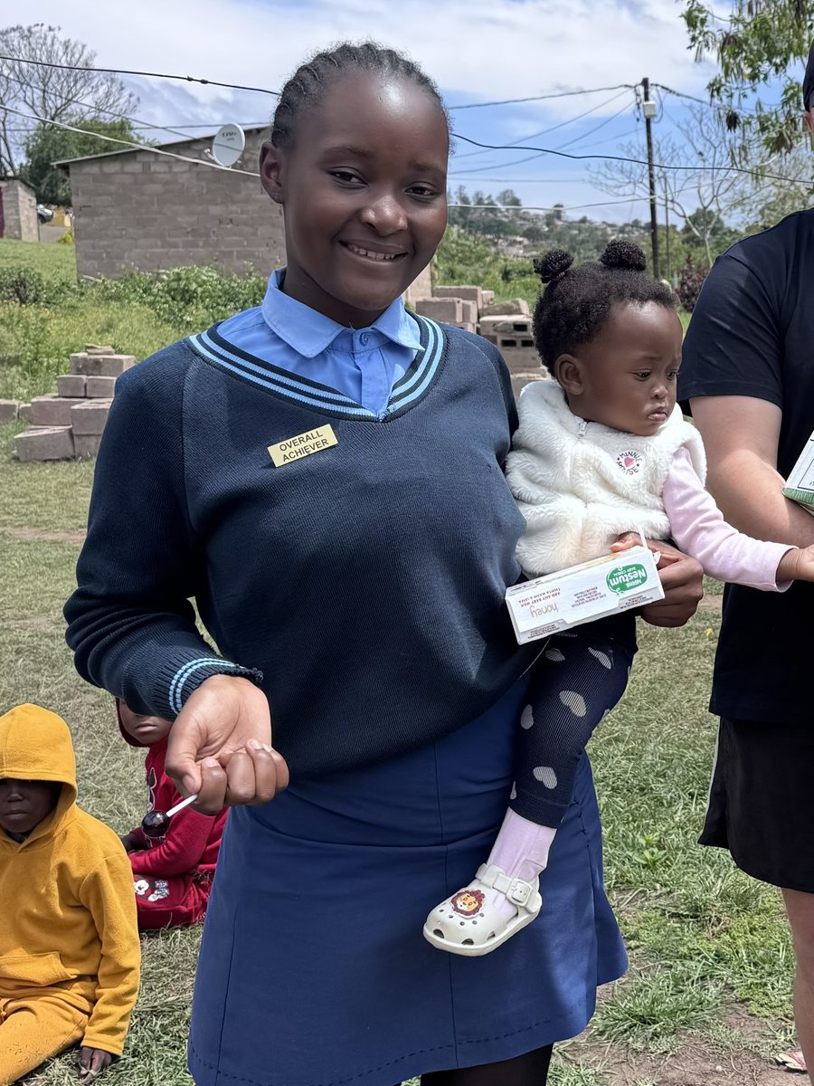 A young mum from our programme holding her baby
