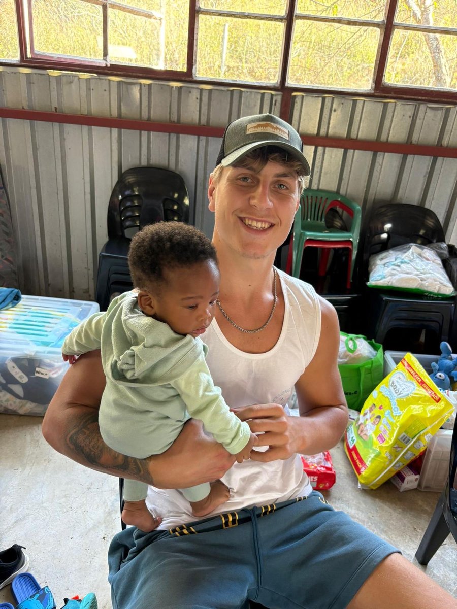 Aaron Revell holding a baby
