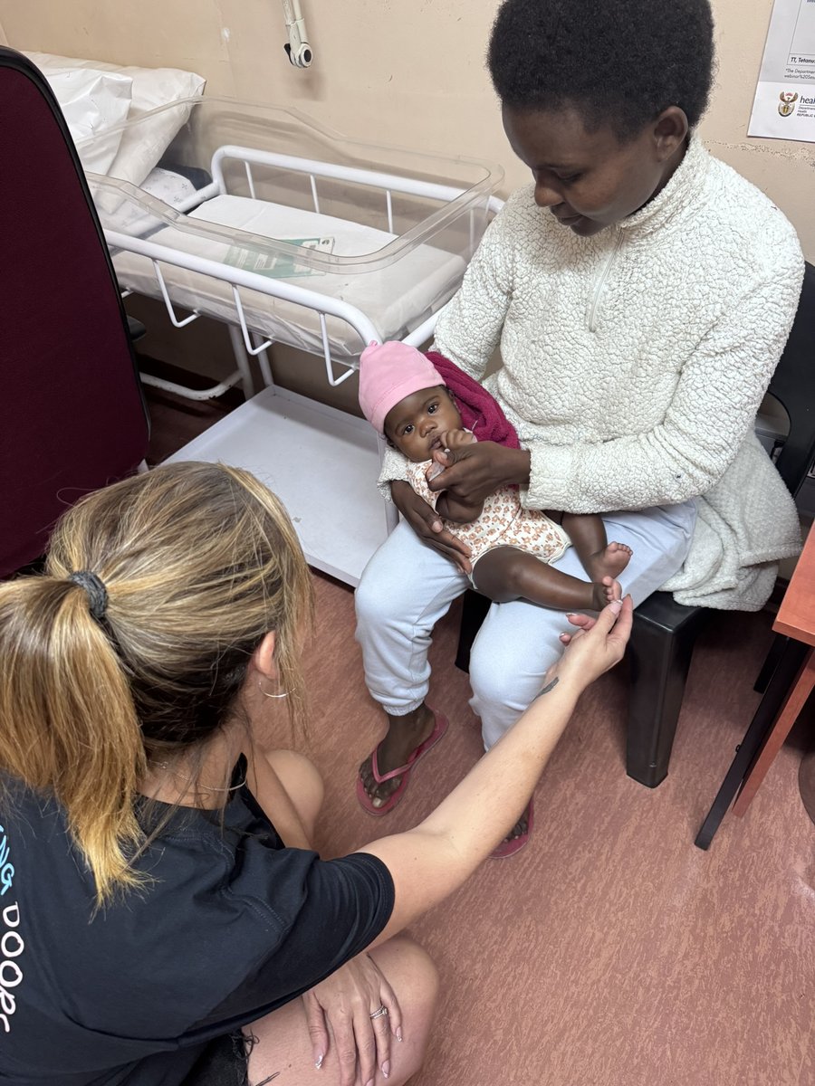 A volunteer engaging with a child in the community